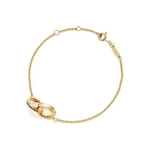 gold bracelet with circle and line through it|interlocking circle bracelet.